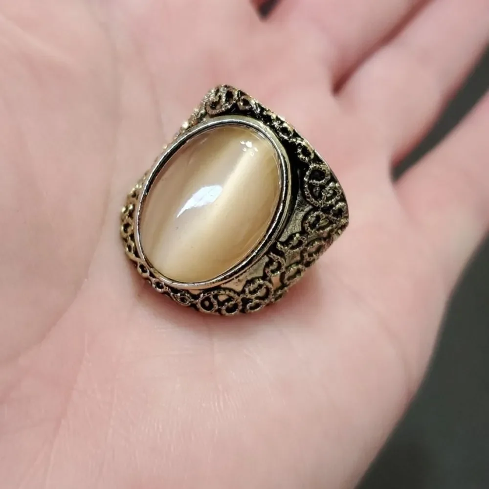 Gold tone ring with stone
